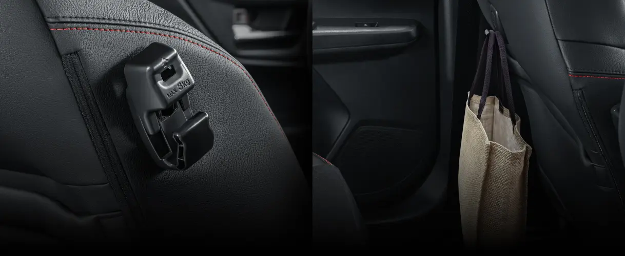 Perodua car in a wide aisle between bays, generous negative space aiding focus.