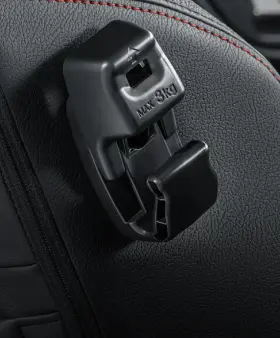 Perodua car nose angled to camera, grille pattern and badge read cleanly.