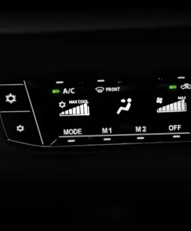 Perodua car side mirror close-up with integrated indicator detail.