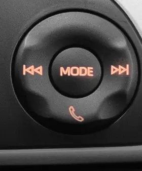 Perodua car on fine gravel, small shadows adding subtle depth to the stance.